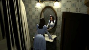 A woman in a blue maid's dress stands in front of an oval mirror above a sink in a bathroom