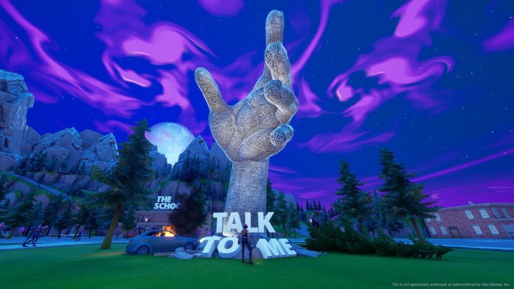 Uma escultura gigante feita em Fortnite da mão do Talk to Me, que é fixada permanentemente em um gesto de tremer