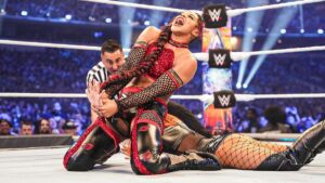 Bianca Bel-Air pulls up Becky Lynch's arm and yells toward the sky