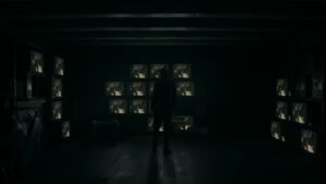 Alan Wake 2 Character Surrounded By Tvs