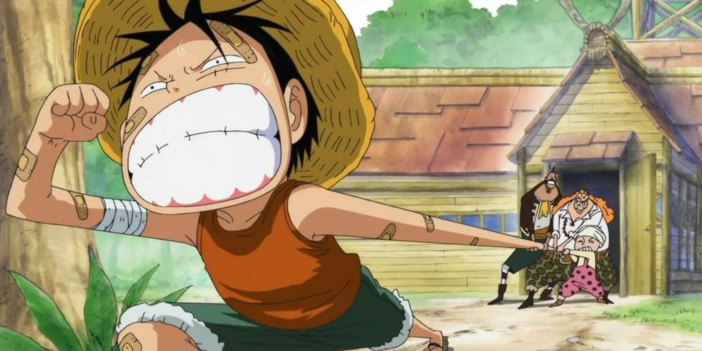 Jovem Luffy correndo com o braço esticado para trás em One Piece