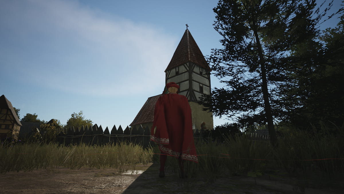 Jogador do Manor Lords em frente à igreja orando por mais conteúdo