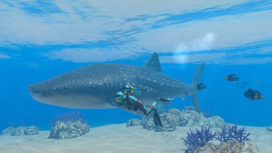 Captura de tela da revisão do Endless Ocean Luminous mostrando um mergulhador nadando ao lado de um tubarão-baleia e espigas azuis