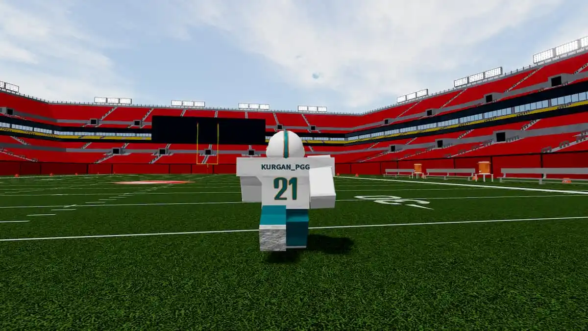 Jogador do Football Fusion 2 com uniforme do Miami Dolphins correndo pelo campo de futebol