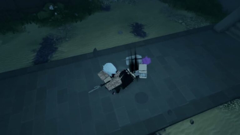 An overhead view of three avatars in the Roblox game ‘Roblox Sorcery,’ standing on a grey stone pavement next to a body of water under dim lighting. The central avatar is dressed in black with white hair, flanked by one avatar with purple hair.