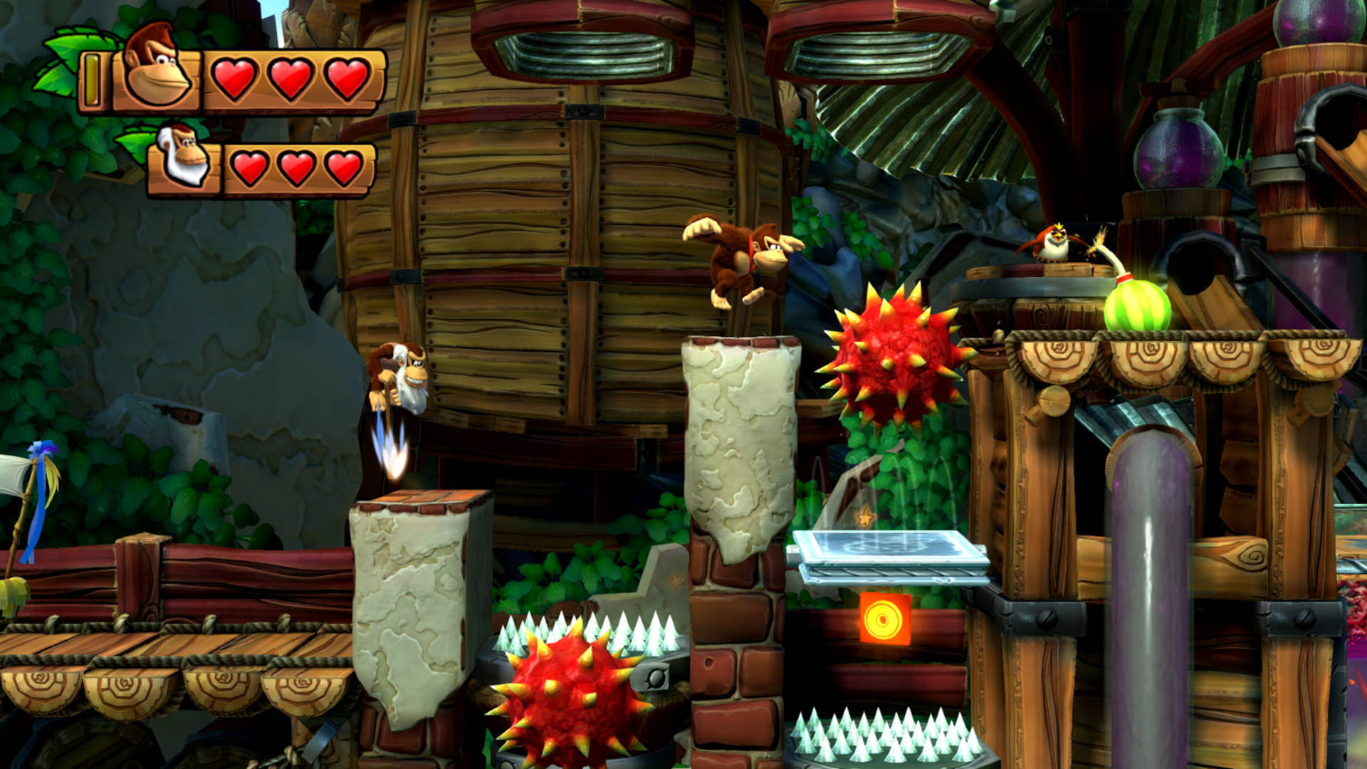 Donkey Kong Country: Tropical Freeze review - Donkey Kong saltando sobre um poço de espinhos