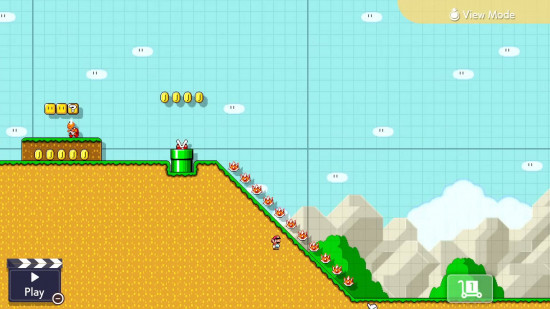 Análise de Super Mario Maker 2 - Mario deslizando por uma colina gramada amarela